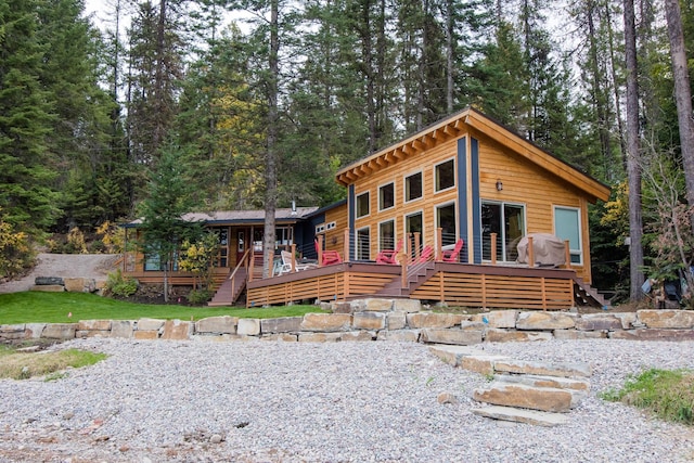 log cabin featuring a wooden deck