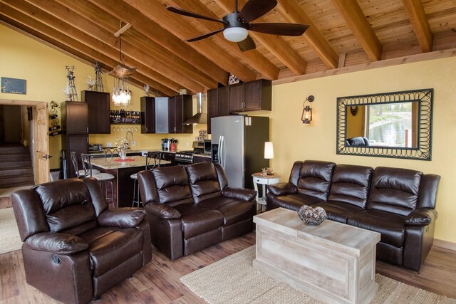 1226 Echo Lake Rd, Bigfork, MT 59911 - living area with wood finished floors, ceiling fan, wooden ceiling, and stairway