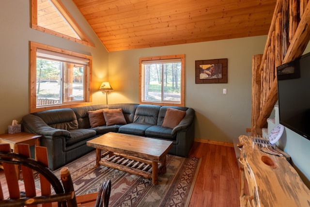 living room with wooden ceiling, plenty of natural light, hardwood / wood-style floors, and vaulted ceiling