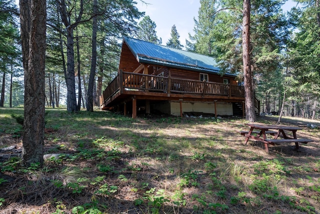 rear view of property with a deck