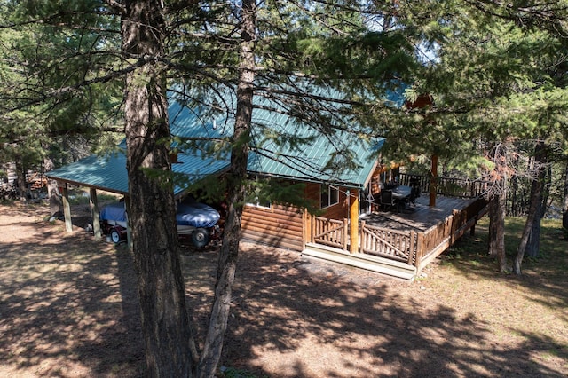 exterior space featuring a wooden deck