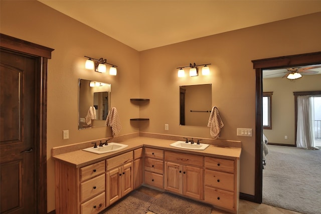 bathroom with ceiling fan and vanity