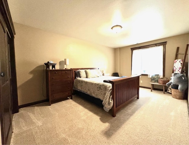 bedroom with light colored carpet