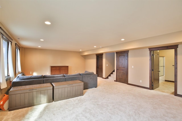 living room featuring light carpet