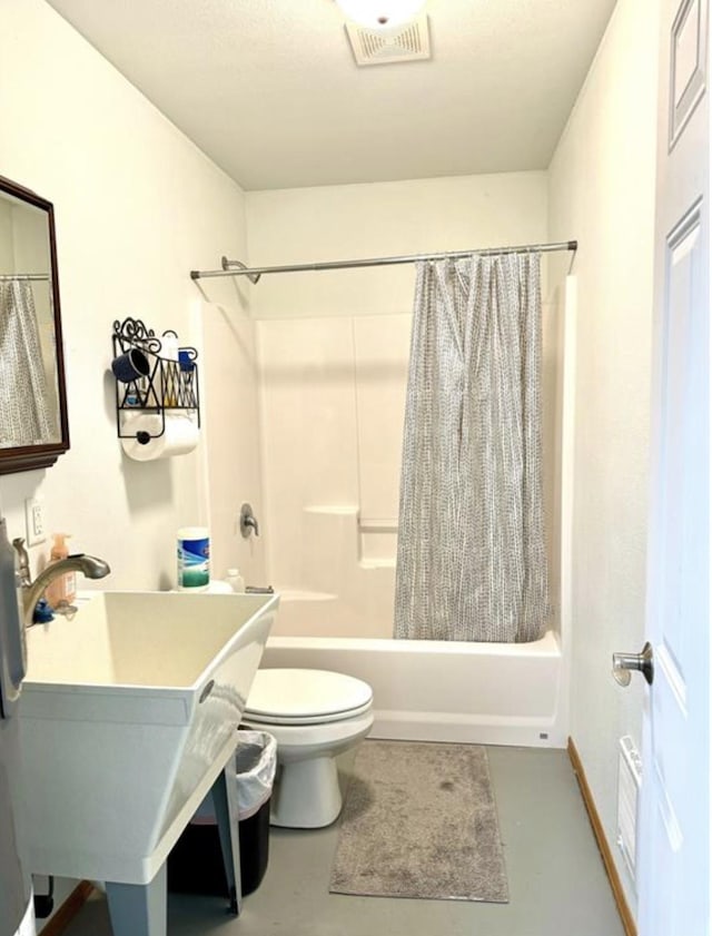 full bathroom featuring sink, toilet, concrete flooring, and shower / bath combination with curtain