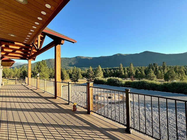 wooden terrace featuring a mountain view