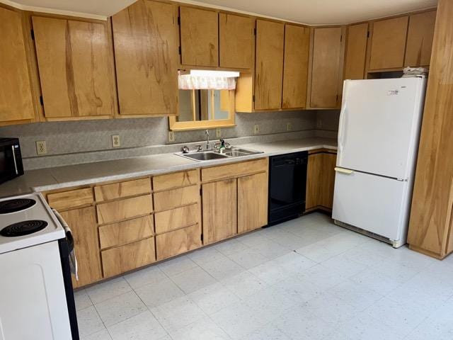 kitchen featuring sink and black appliances