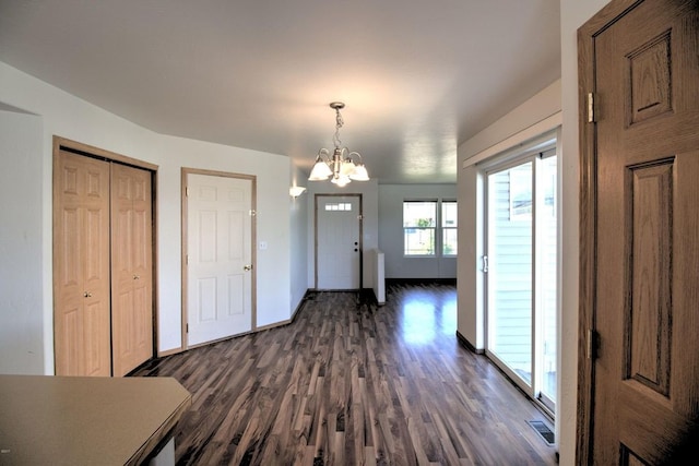 7AND9 Stratford Dr, Kalispell, MT 59901 - entryway with dark hardwood / wood-style flooring and a chandelier