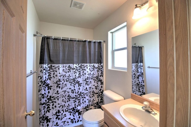 7AND9 Stratford Dr, Kalispell, MT 59901 - bathroom featuring vanity, a shower with shower curtain, and toilet