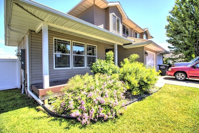 7AND9 Stratford Dr, Kalispell, MT 59901 - view of front of home featuring covered porch and a front lawn