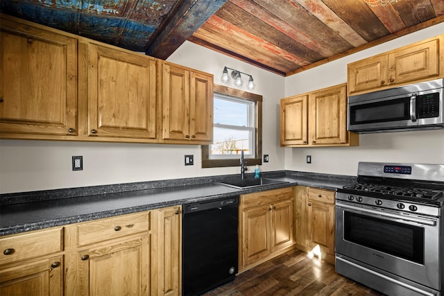 kitchen with dark wood-type flooring, sink, beamed ceiling, and stainless steel appliances