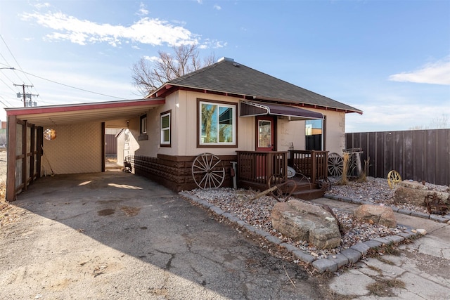 view of front of property with a carport