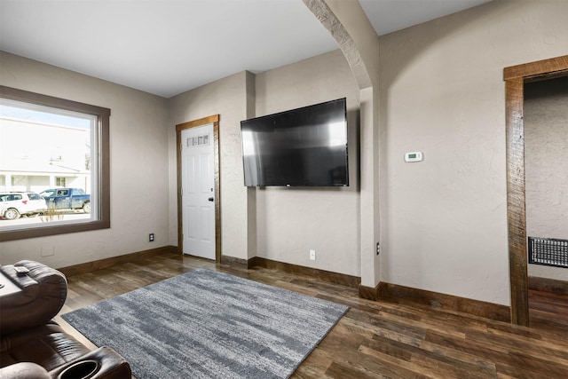 living room featuring dark hardwood / wood-style flooring