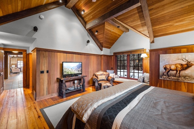 2120 Iron Horse Dr Unit 11, Whitefish, MT 59937 - bedroom with hardwood / wood-style flooring, wooden ceiling with exposed beams, multiple windows, and high vaulted ceiling