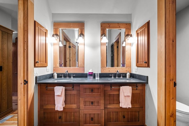 2120 Iron Horse Dr Unit 11, Whitefish, MT 59937 - bathroom featuring double vanity and toilet