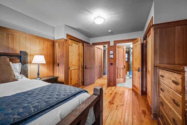 2120 Iron Horse Dr Unit 11, Whitefish, MT 59937 - bedroom with light wood-style flooring and two closets