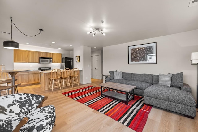 living room with light hardwood / wood-style floors