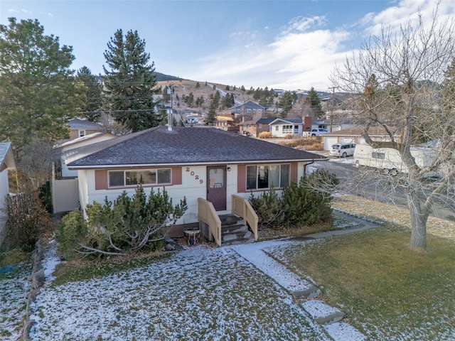 ranch-style home with a front lawn