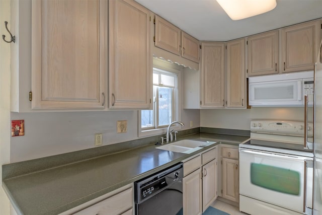 kitchen featuring sink, white appliances, and light brown cabinets