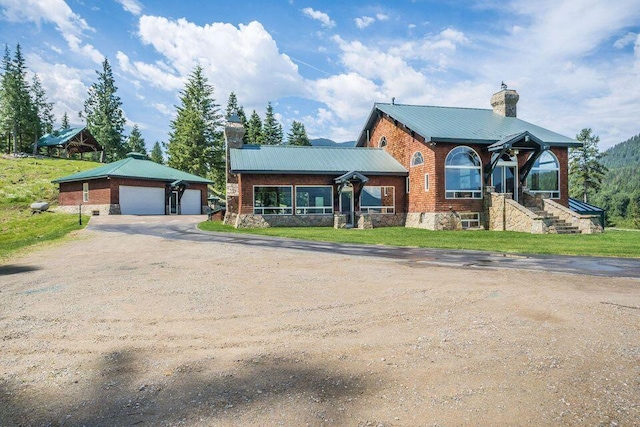 view of front facade with an outdoor structure and a garage