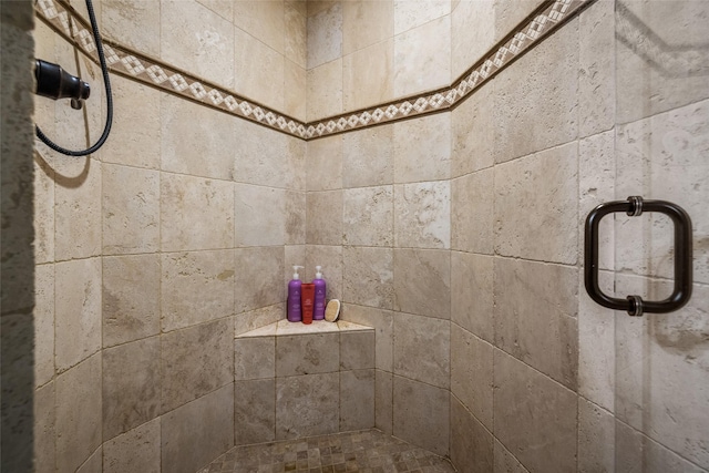 interior details featuring an enclosed shower