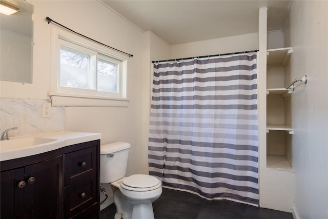 bathroom featuring decorative backsplash, vanity, and toilet