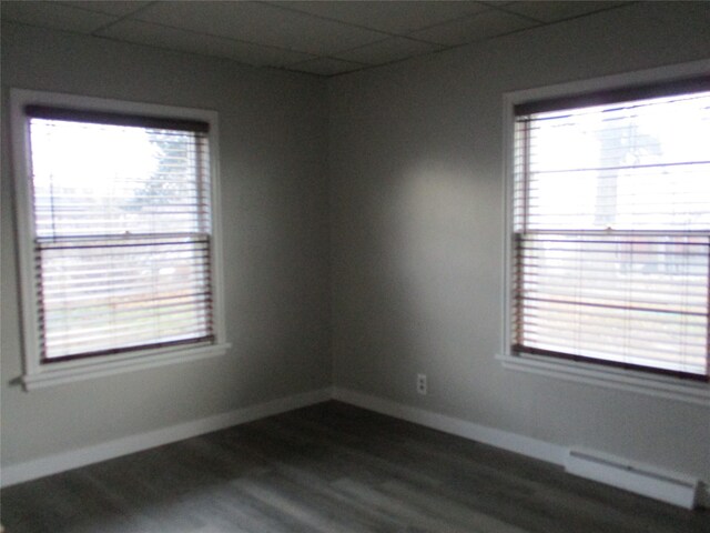 spare room with dark hardwood / wood-style floors