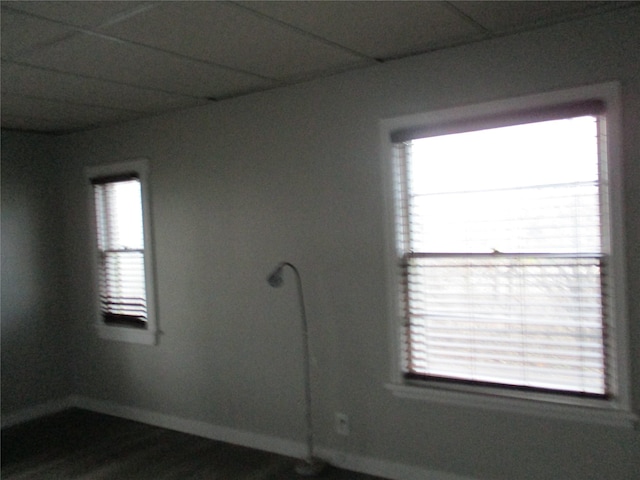 unfurnished room with wood-type flooring