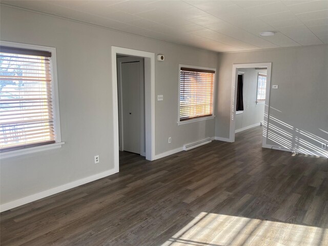 unfurnished room featuring dark wood-type flooring