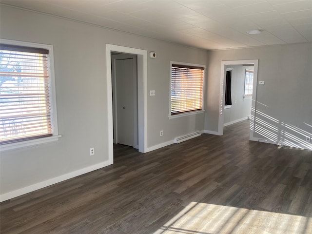 spare room featuring dark wood-type flooring