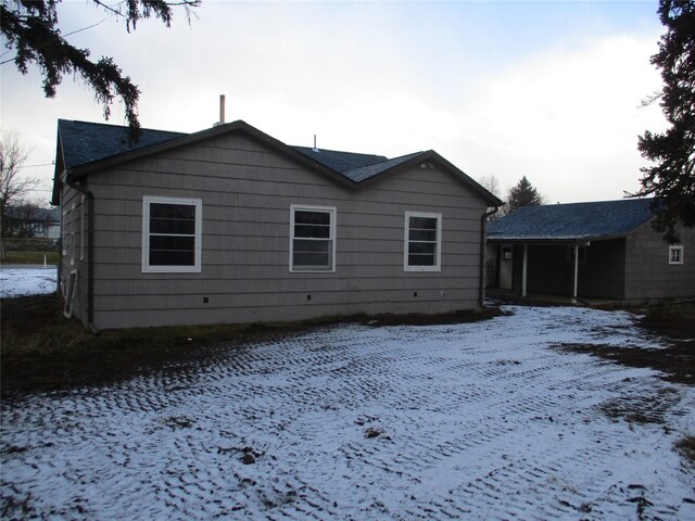 view of side of home featuring a carport