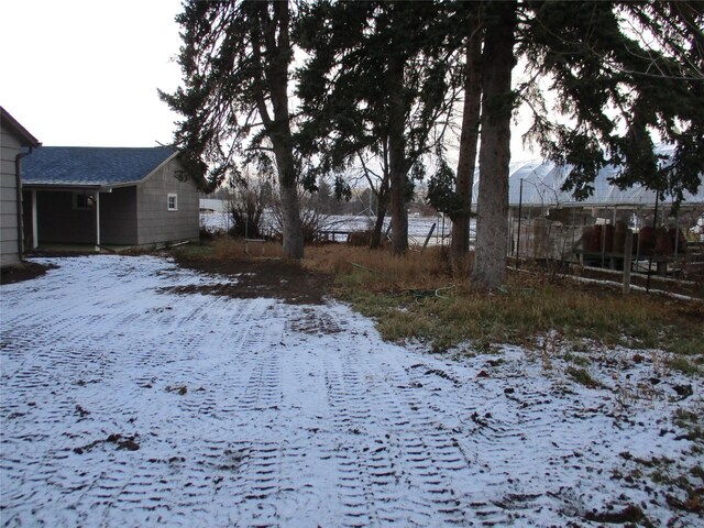 view of yard layered in snow