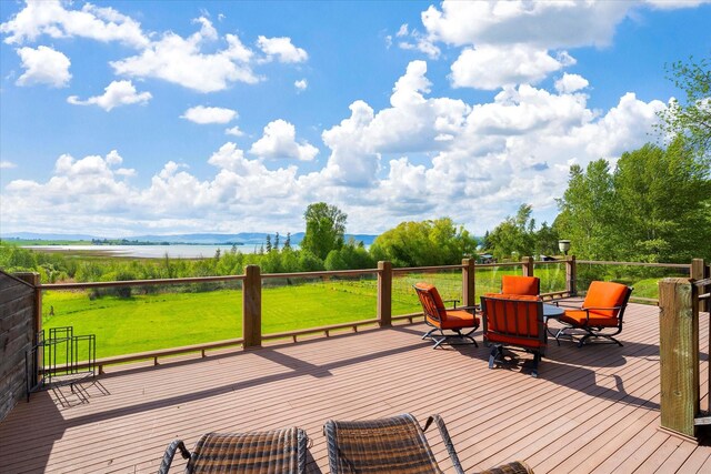 deck with a grill and a pergola