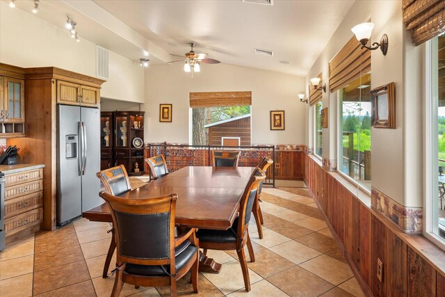 kitchen with sink, light tile patterned floors, and stainless steel appliances