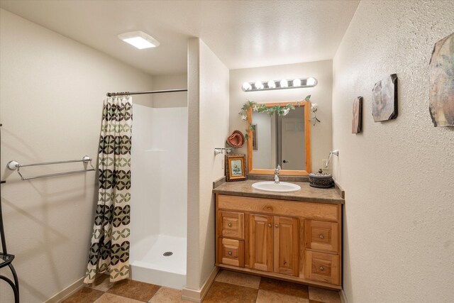 bathroom with vanity and curtained shower