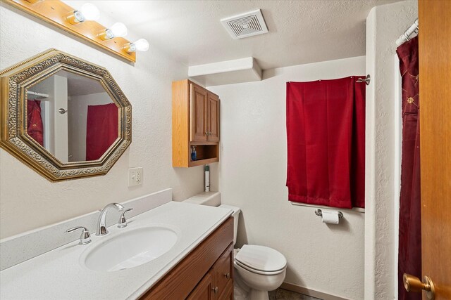 bathroom featuring sink and a baseboard radiator