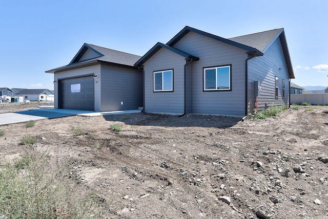 ranch-style home featuring a garage