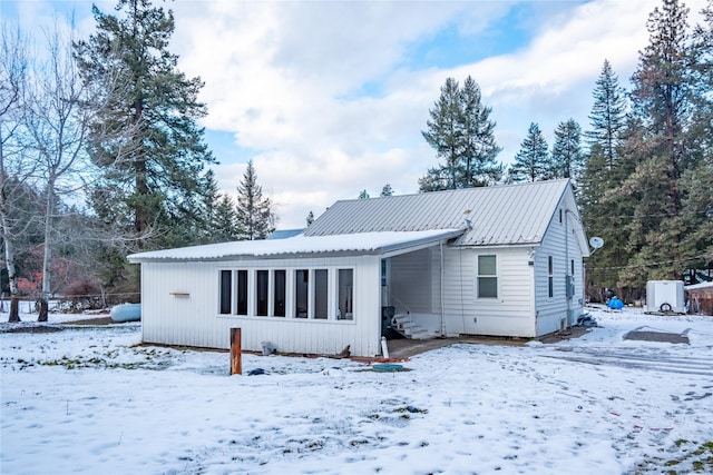 view of snow covered house