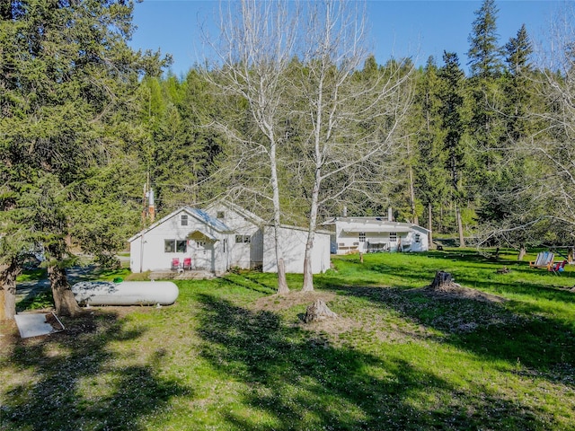 view of yard with a wooded view