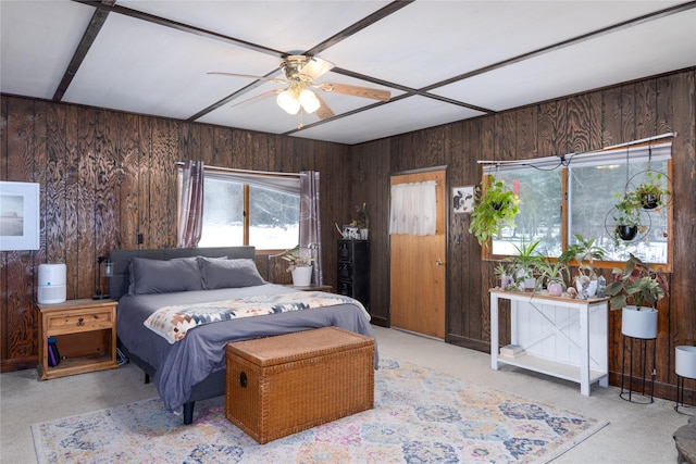 carpeted bedroom with wood walls