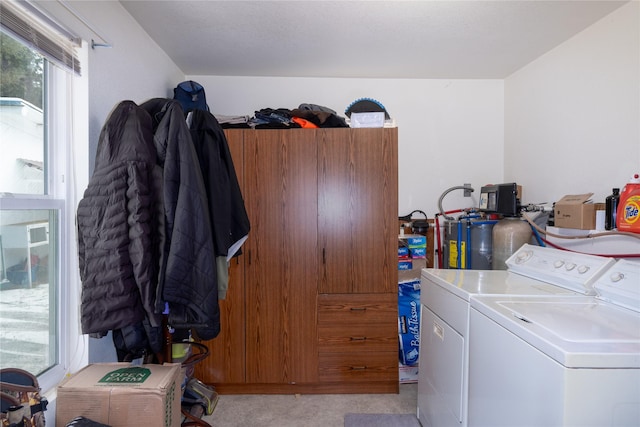 laundry area featuring separate washer and dryer and laundry area