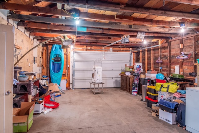 garage featuring washer / clothes dryer and a garage door opener