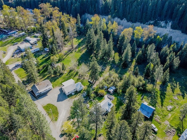 drone / aerial view featuring a view of trees