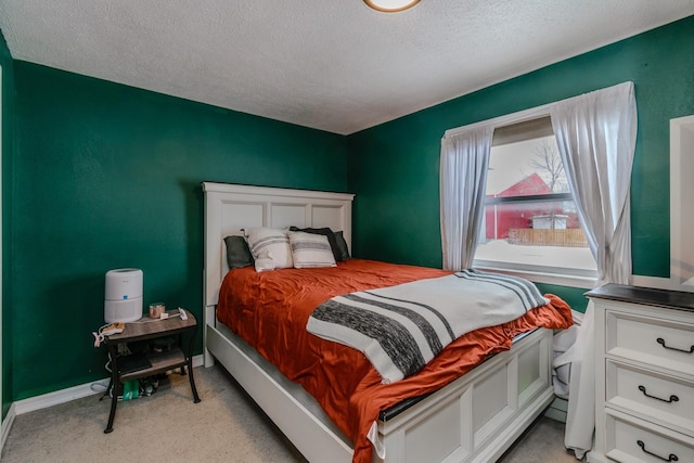 carpeted bedroom with a textured ceiling