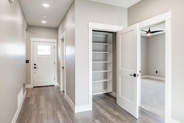 hallway featuring light wood-type flooring