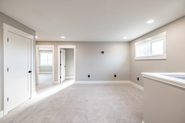 carpeted spare room with plenty of natural light