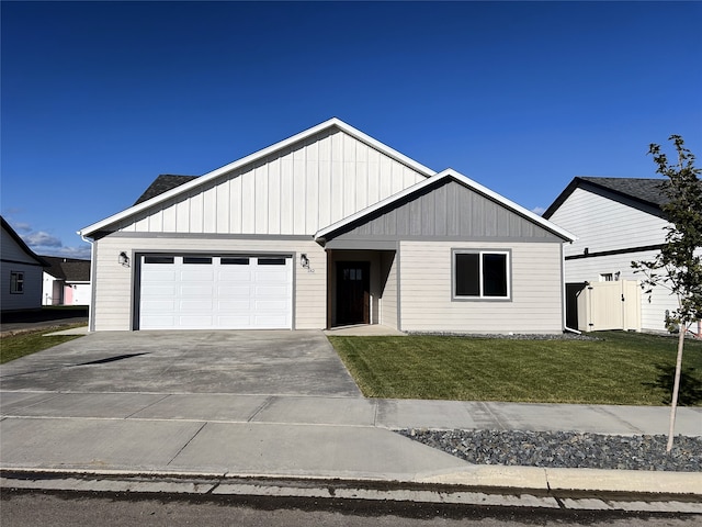 view of front of home with a garage and a front yard