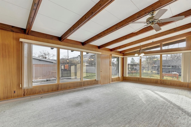 unfurnished sunroom with ceiling fan with notable chandelier and vaulted ceiling with beams