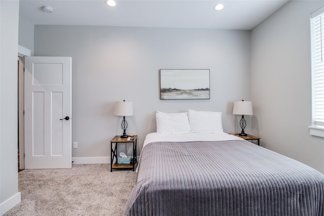 bedroom featuring light colored carpet