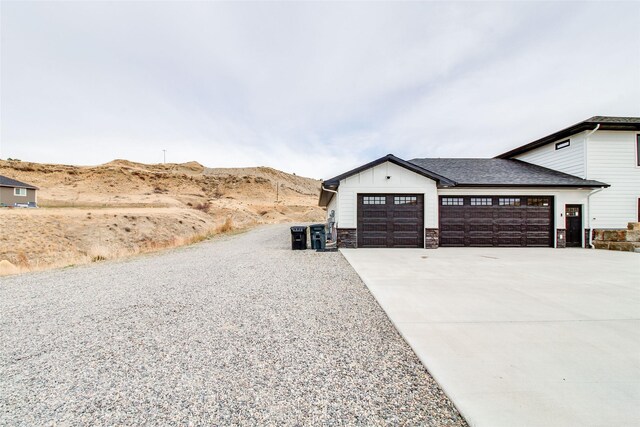 exterior space with a mountain view and a garage